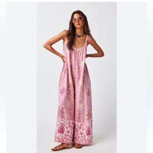 Lillie One Piece
Free People Pink & White Jumpsuit size small bottom edge stain